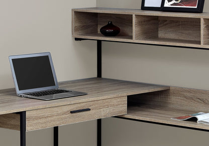 A contemporary L-shaped computer desk with storage drawers, designed for home offices, featuring space for a laptop and decor, placed against a light-colored wall.