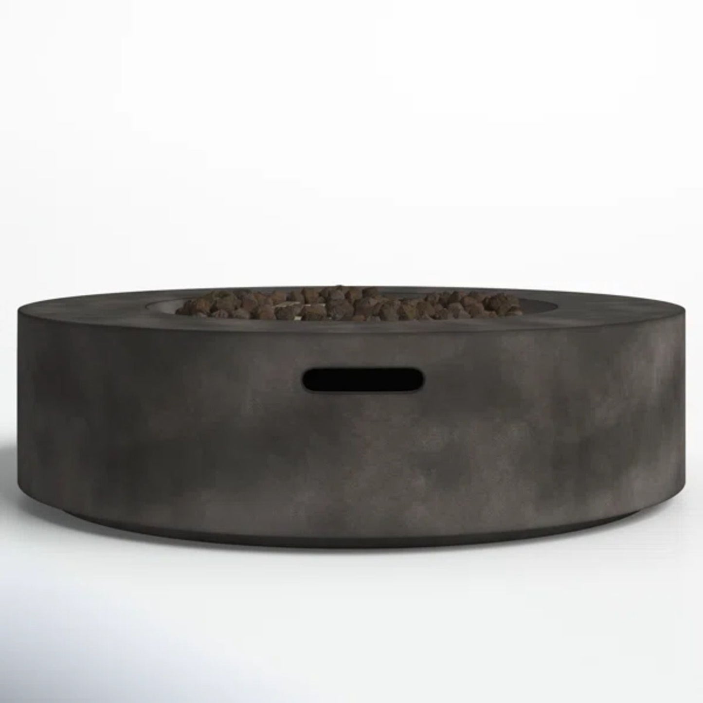 The Fiber Reinforced Outdoor Fire Pit Table in black/gray is a modern round fire pit made of smooth concrete, featuring a central area with small rocks and a rectangular cutout on the side.