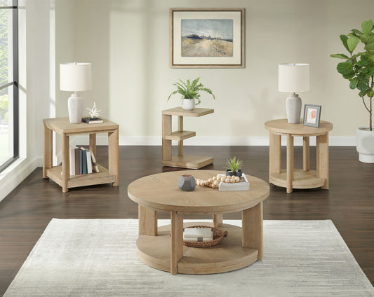 A bright living room features the Clove Chairside Table in tan, a light rug, table lamps, books, plants, and a framed landscape painting. A large window and green potted plant complete the modern decor.