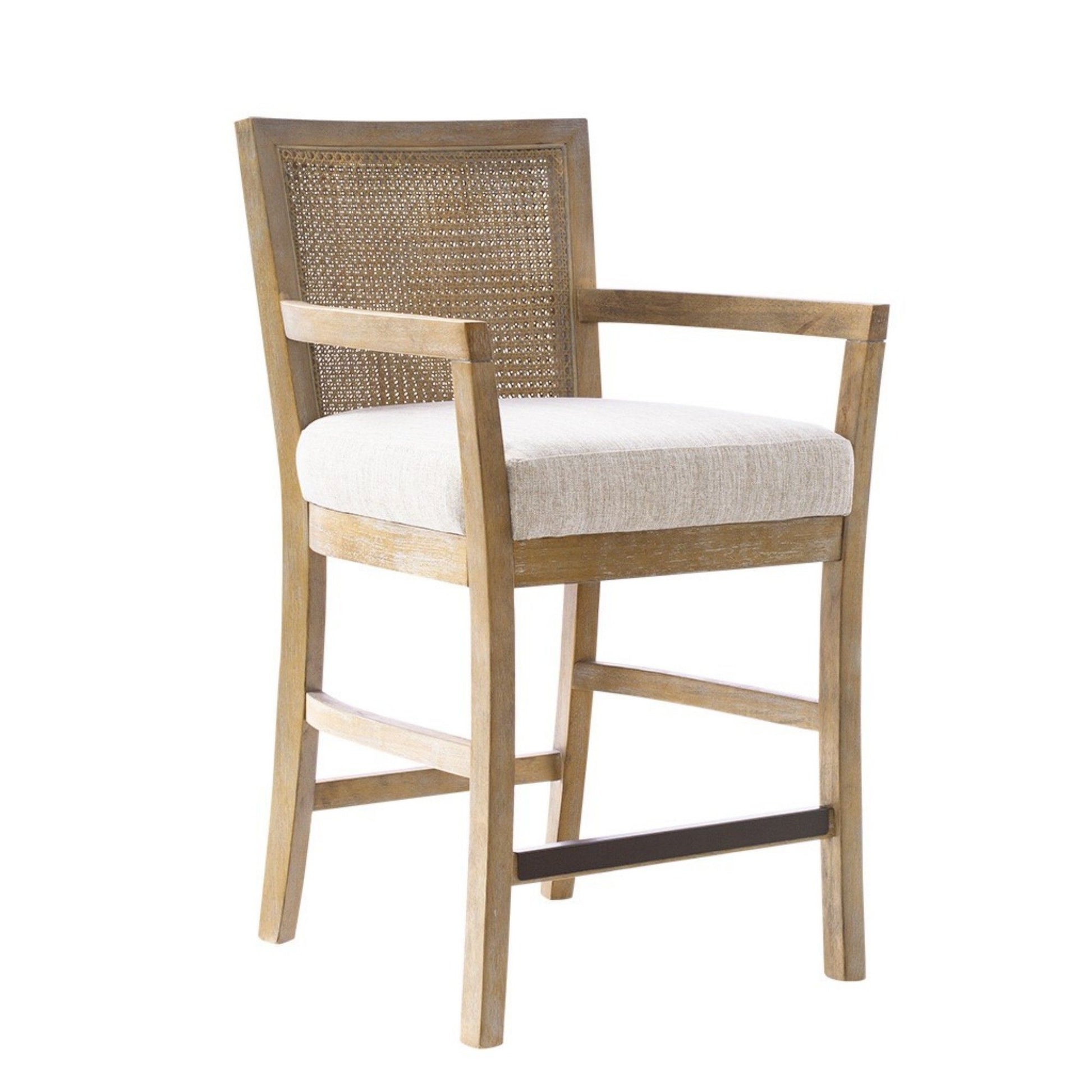 The Cane Back Counter Stool features a woven cane backrest, cream upholstered seat, and straight legs with a footrest bar in a reclaimed natural wood finish.