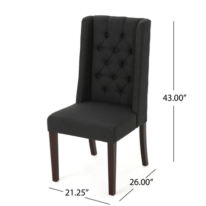 The Sophisticated Tufted Dining Chair With High Back Design is upholstered in black, features button tufting on the backrest, dark wooden legs, and measures 43"H x 26"D x 21.25"W.