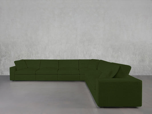A 6-Seat Modular Corner Sectional with a modern, minimalist design and clean lines in dark green is arranged L-shaped on a light grey floor against a plain textured grey wall.