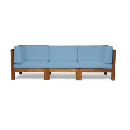 The Oana 3 Piece Sofa Set features an L-shaped wooden frame with light blue water-resistant seat and back cushions, shown from the front against a white background.