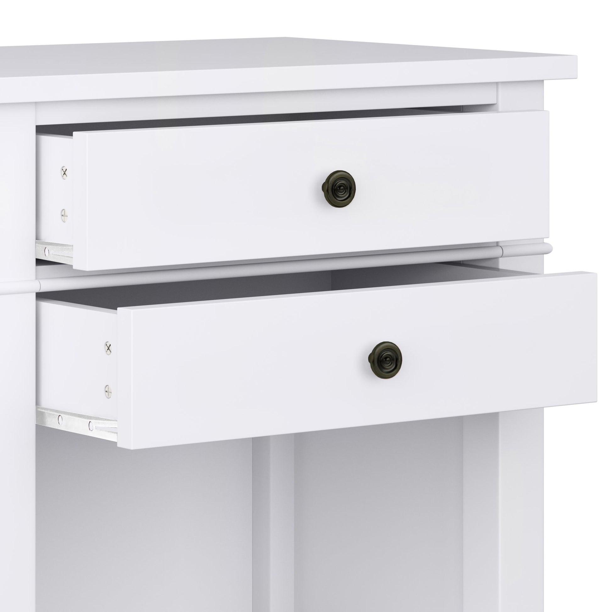A close-up of the Carlton - Bedside Table, Handcrafted, shows its white finish and two partially open drawers with round, dark metal knobs. The bedside table boasts a simple, modern design with clean lines.