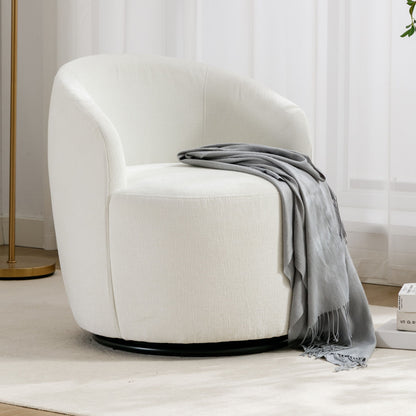 A Chenille Fabric Swivel Accent Armchair Barrel Chair with a curved backrest sits on a light rug, draped with a gray throw. Sheer white curtains and part of a gold floor lamp appear in the background.