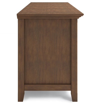 Side view of the Amherst Wide TV Media Stand featuring a rectangular top and simple, straight legs. Finished in rustic natural aged brown wood with a smooth texture, set against a plain white background.