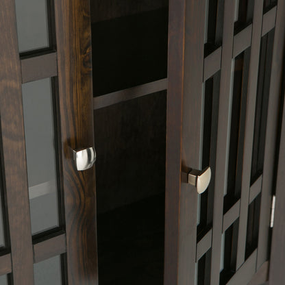 Close-up of the Bedford Storage Media Cabinet in dark wood with glass-paneled doors and modern silver handles, shown partially open to reveal its empty shelves inside.