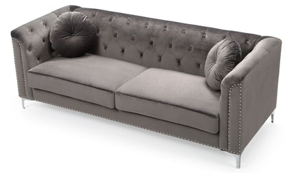 The Elegant Contemporary Sofa features gray velvet upholstery, two round matching pillows, silver nailhead trim on the arms, and sleek metal legs, displayed against a white background.
