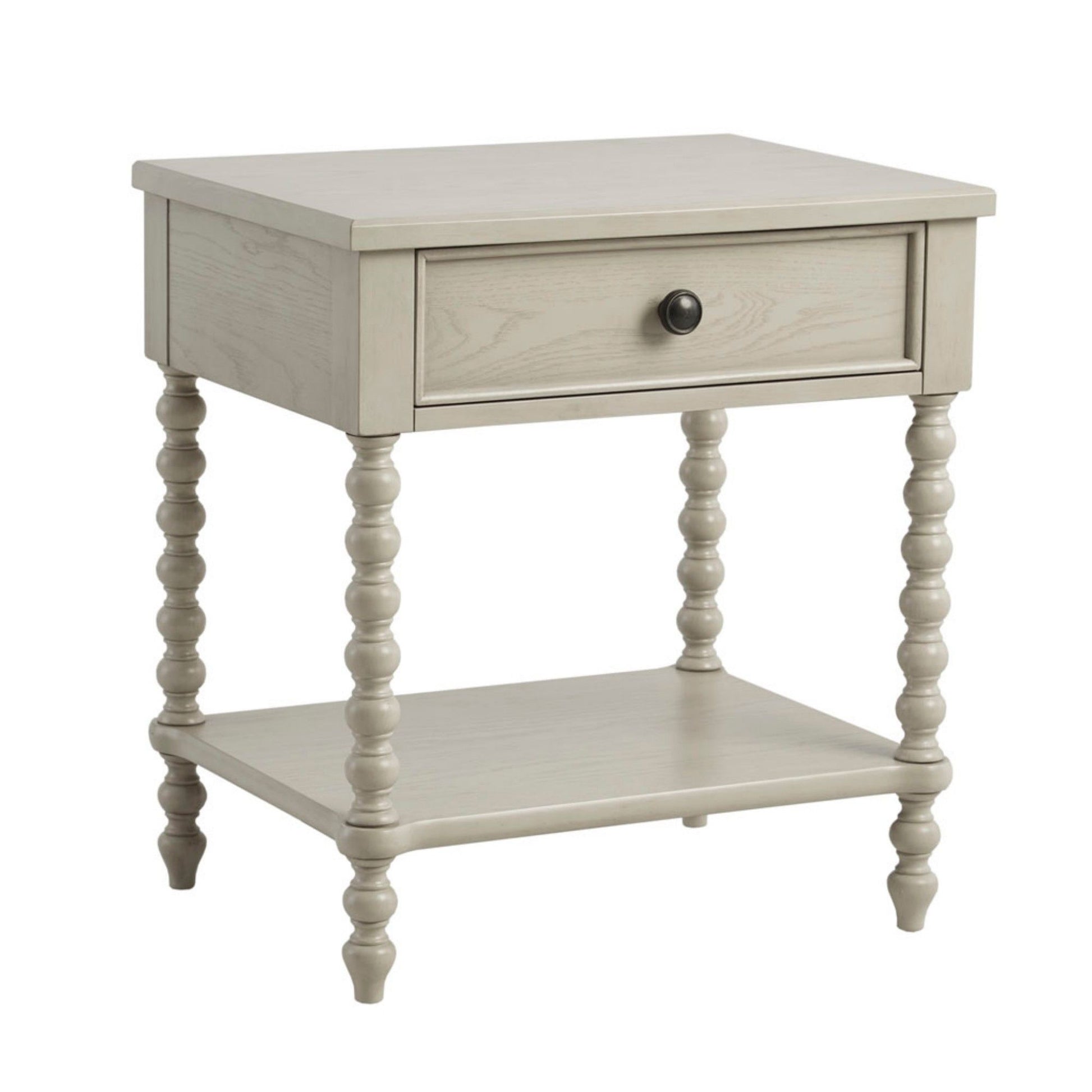 The Traditional Durable Nightstand Table With Drawer And Shelf is a light gray wooden nightstand featuring a single drawer with a round black knob, four turned legs, and a lower shelf for extra storage.