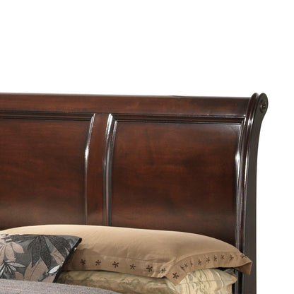 A close-up of the LaVita - Storage Bed's dark wood sleigh headboard with a glossy finish. Beige pillows featuring leaf and star patterns appear at the bottom of the image.