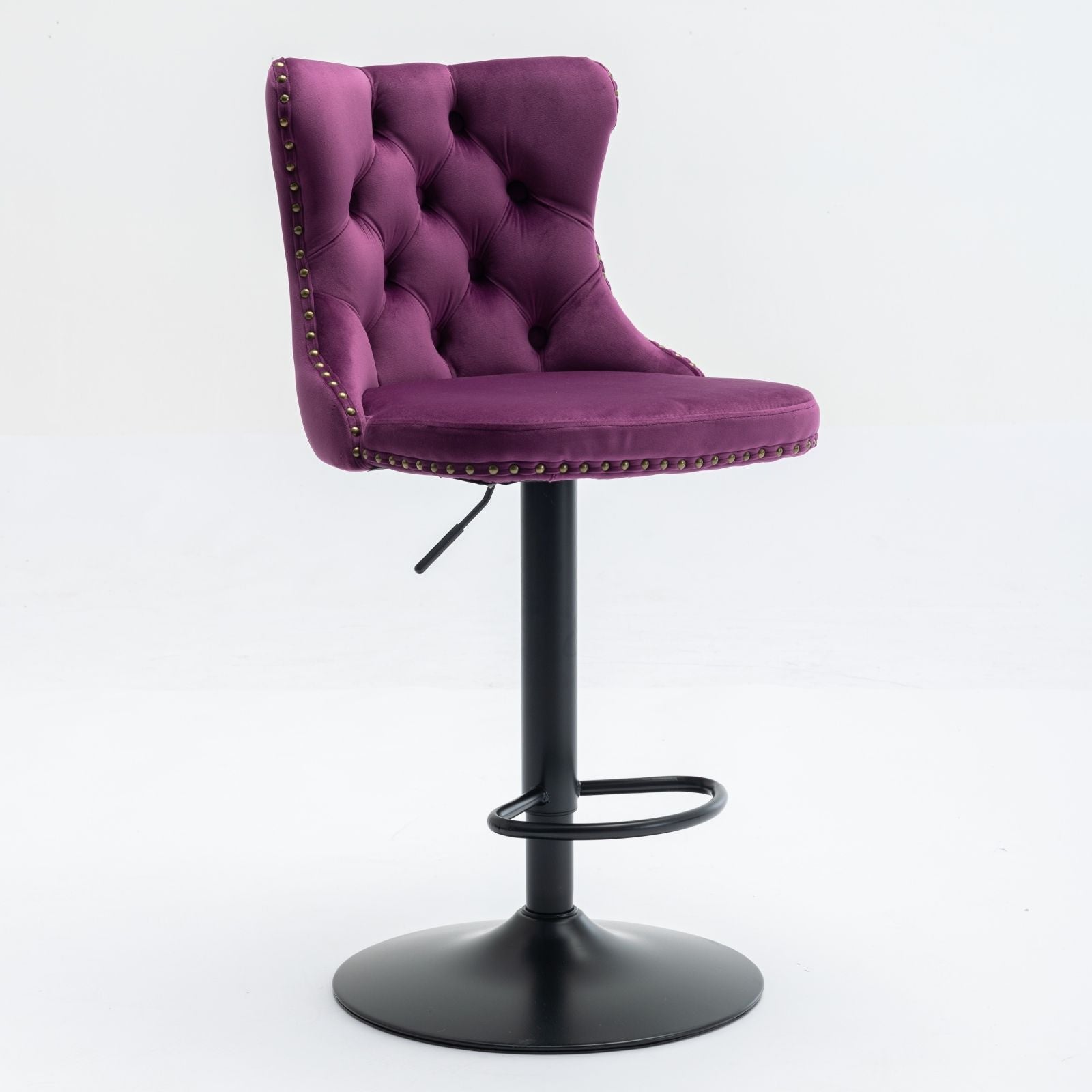 The Swivel Velvet Barstools (Set of 2) feature adjustable seat height, plush purple tufted upholstery with gold stud accents, and a black metal pedestal base with a circular footrest—ideal for home pub or kitchen island use.