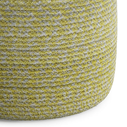 Close-up of the Bayley - Versatile Round Braided Pouf, featuring a textured woven surface in yellow and gray tones, set against a white background.