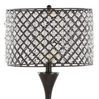A close-up of the Topaz - Contemporary Table Lamp, featuring a black metal base and a cylindrical lattice-patterned shade adorned with clear crystal-like accents.