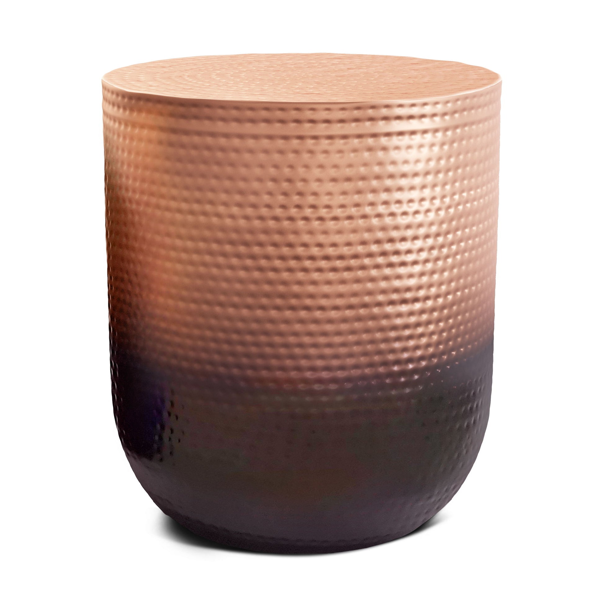 The Nova Handcrafted Metal Side Table features a round, drum shape and a textured metallic surface with a copper tone at the top that fades to an almost black base.