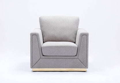 The Couch.com Valin Linen Chair for Living Room features a modern gray fabric design with thick cushioned seat and backrest, square armrests, and a light-colored base, shown against a plain white background.