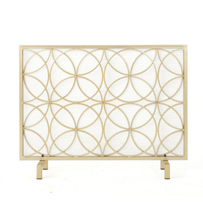 The Thayer Single Panel Iron Fireplace Screen features a geometric design of overlapping gold circles and stands on two rectangular legs, shown against a white background.