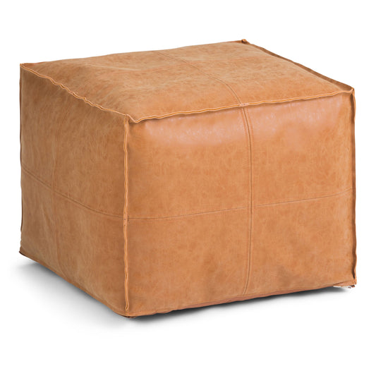 The Brody - Versatile Square Pouf is a tan leather, square ottoman featuring visible seam stitching, shown against a plain white background.