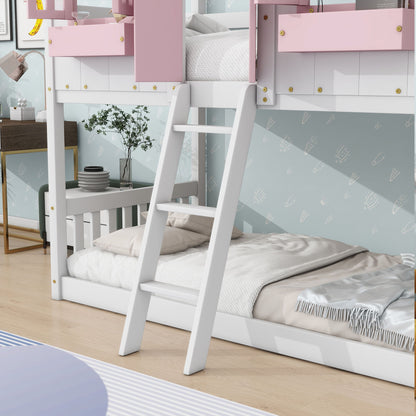 The House Bunk Bed With Roof, Window, Window Box, Door, and Safety Guardrails features a ladder and is styled with light pink accents on the top bunk, neat beige and striped bedding, in a tidy kids' room with blue arrow-patterned wallpaper.