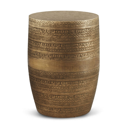 The Johnsen - Handcrafted Large Metal Accent Table is a cylindrical side table with a metallic gold finish and horizontal rows of geometric and circular patterns etched around its surface.