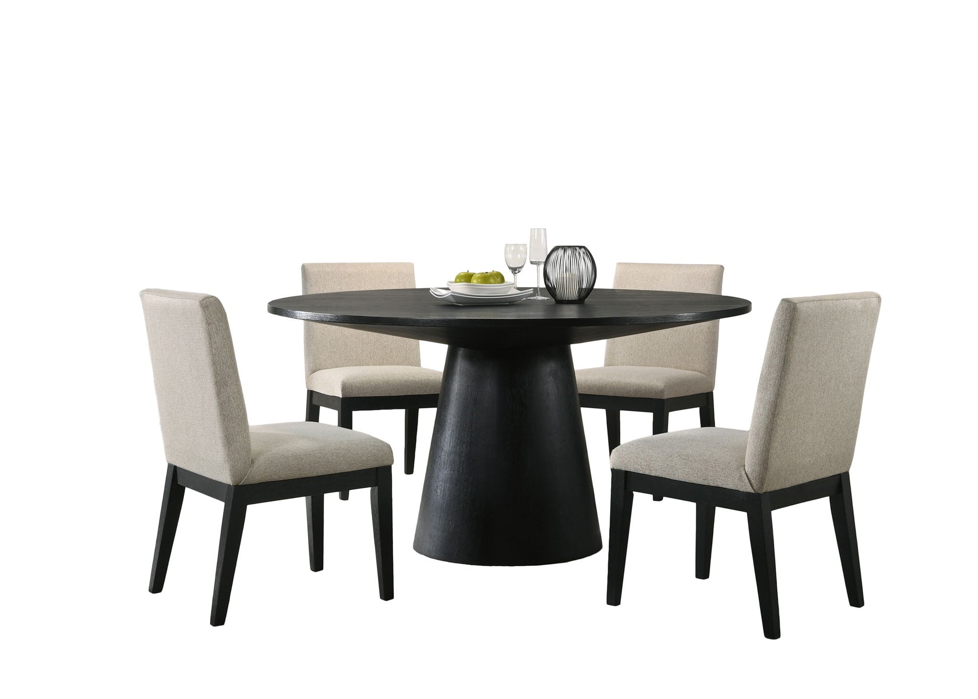The Jasper Wide Contemporary Round Dining Table Set features a round black table with a wide pedestal base and four beige upholstered chairs, styled with plates, glasses, a bowl of green apples, and vases against a white background.