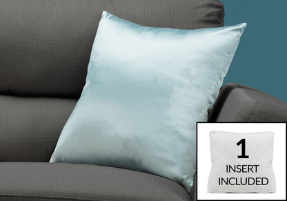 A light blue satin decorative throw pillow rests on a gray couch. In the corner, an inset image displays the hypoallergenic square pillow insert that is included.