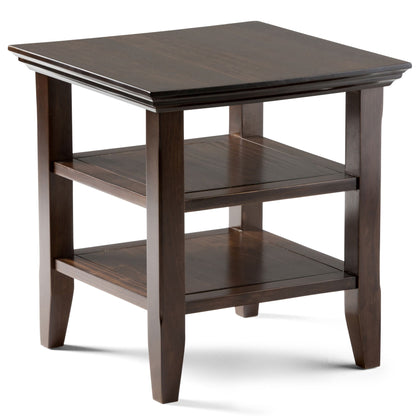 The Acadian - Handcrafted End Table is a dark wood piece with a square top, two lower shelves, straight legs, and a simple, classic design.