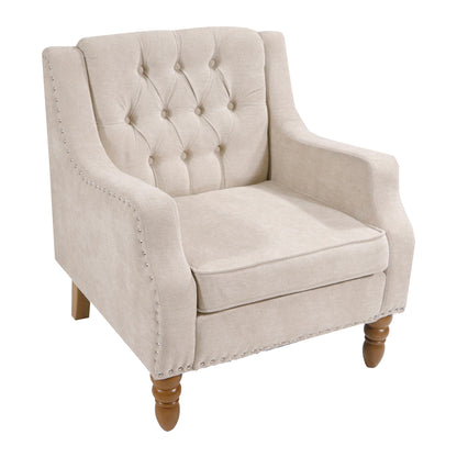 Beige button-tufted upholstered accent chair with vintage brass studs, curved armrests, and wooden turned legs—perfect as a comfy living room, bedroom, or reception room reading chair.