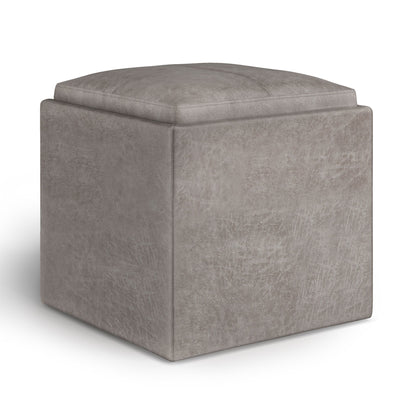 The Rockwood Upholstered Cube Storage Ottoman With Tray features a taupe finish, cushioned top, subtle texture, and is displayed against a white background.