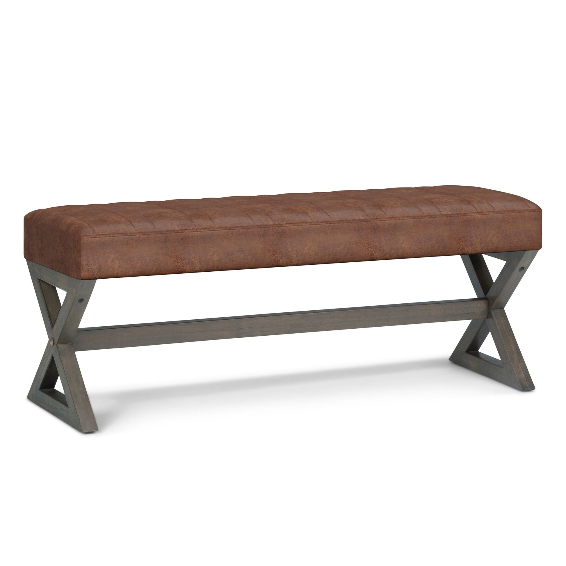 The Salinger - Large Upholstered Ottoman Bench features a tufted brown leather cushion atop dark wooden X-crossed legs, joined by a horizontal support bar.