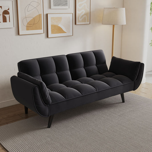 The Sofa Soft with two armrests and cozy pillows sits on a gray rug in a bright living room, decorated with abstract art and a floor lamp, perfect for apartments, bedrooms, or small spaces.