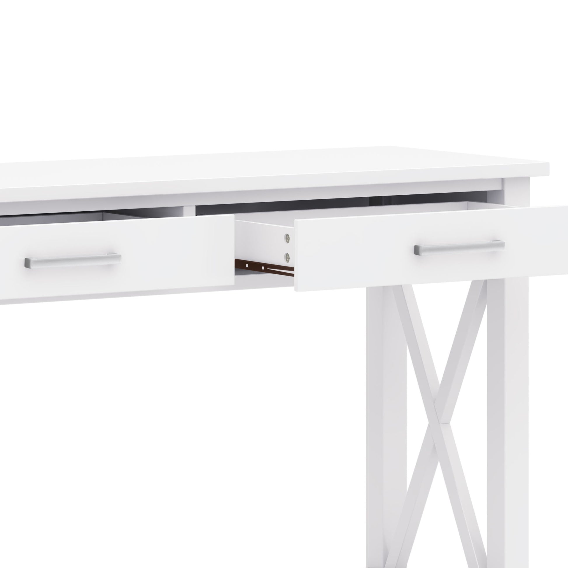 The Kitchener - Handcrafted Table is a modern white desk with two partially open drawers, sleek metal handles, and X-shaped side supports, shown against a white background.