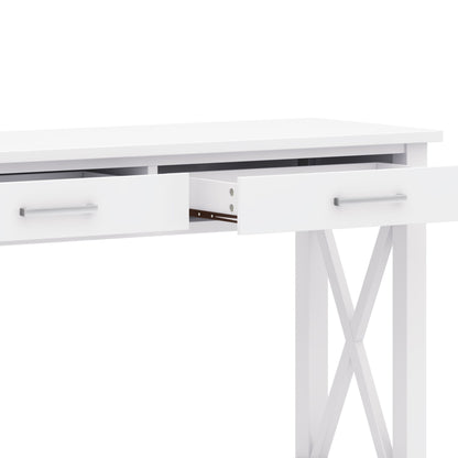 The Kitchener - Handcrafted Table is a modern white desk with two partially open drawers, sleek metal handles, and X-shaped side supports, shown against a white background.