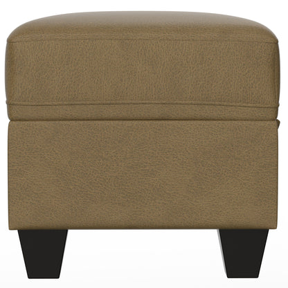 The Drason Storage Ottoman features a square, tan leather design with a cushioned top and short black wooden legs, shown from the front against a white background.