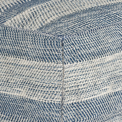 Close-up of the Clay - Square Pouf, Upholstered, featuring blue and white striped fabric with a textured woven pattern and visible stitching at the corner where two sides join.