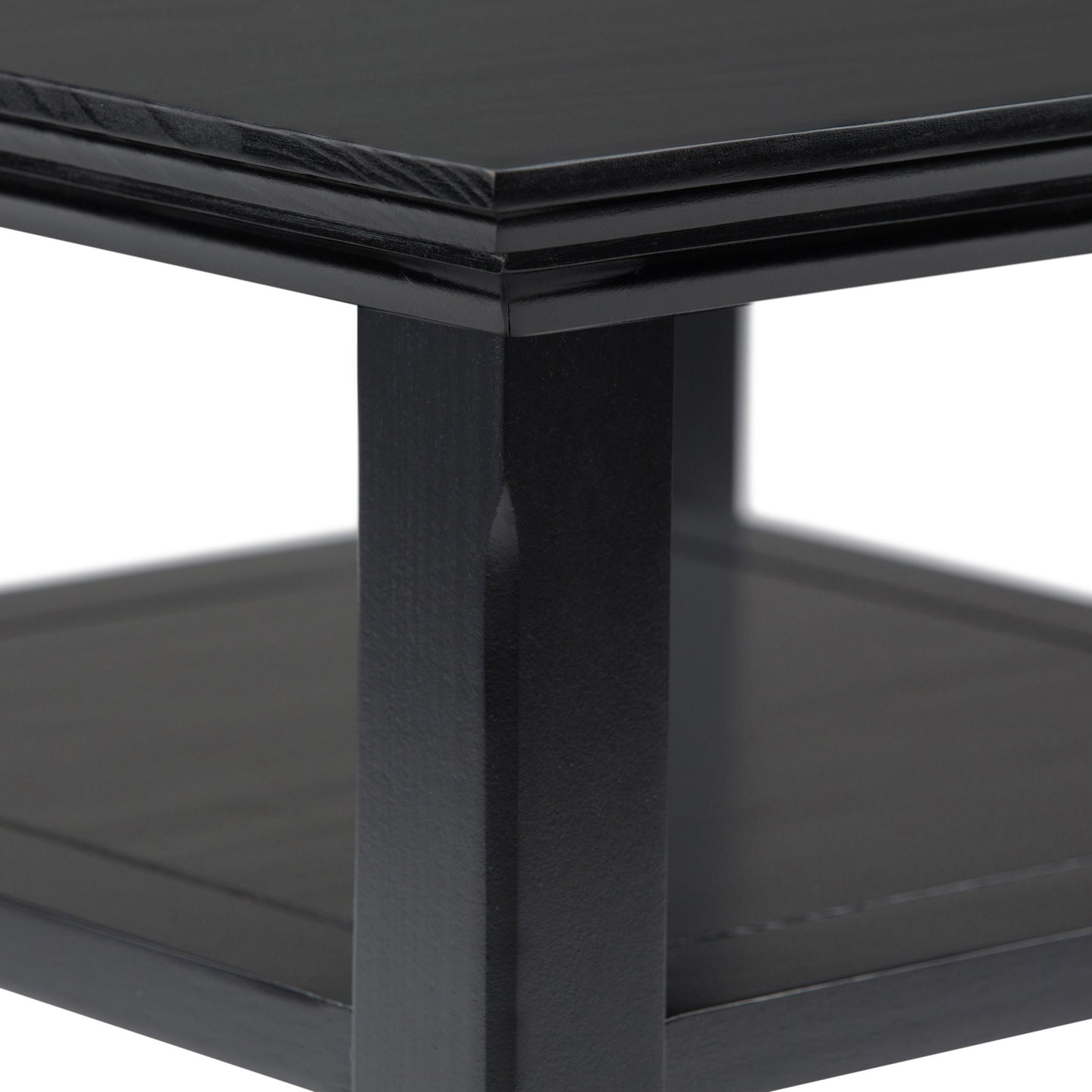 Close-up of the Acadian - Handcrafted End Table, highlighting its black wooden finish, thick square leg, and lower shelf with a clean modern design against a white background.