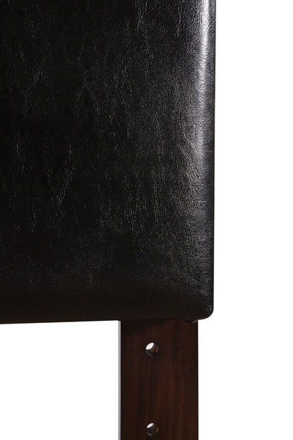 Close-up of the Nova - Headboard in black leather or faux leather with a dark wooden leg at the bottom right, set against a plain white background.