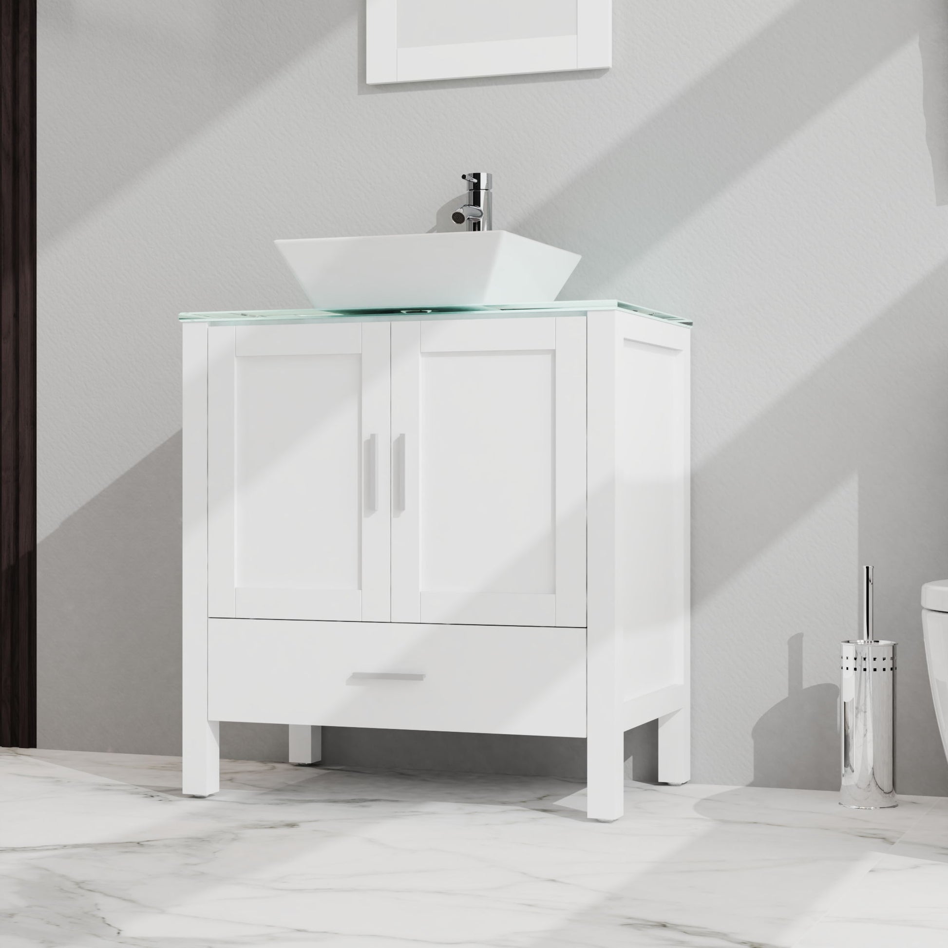 Bathroom Vanity And Sink Combo Glass Top Cabinet With Mirror features two cabinet doors, one drawer, a vessel sink with faucet, and stands on four legs on a marble floor. A partial view of a toilet appears to the right.