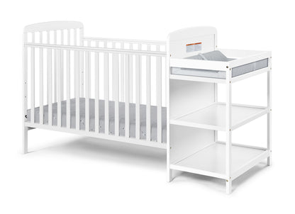 The Ramsey 3-in-1 Convertible Crib/Changer Combo features a white wooden crib with vertical slats, attached to a matching changing table with two open shelves and a padded mat on top.