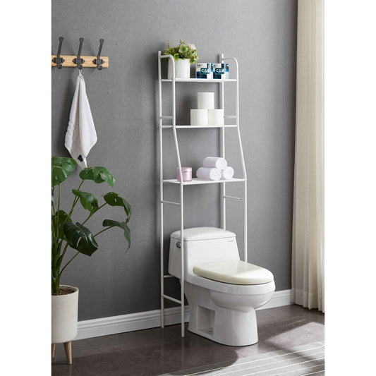 A modern bathroom features the Three Tier Over The Toilet Storage Shelf - Wood, stocked with plants, towels, and toiletries. A nearby potted plant and wall hooks with a hanging towel add style. Natural light enters through a curtain on the right.