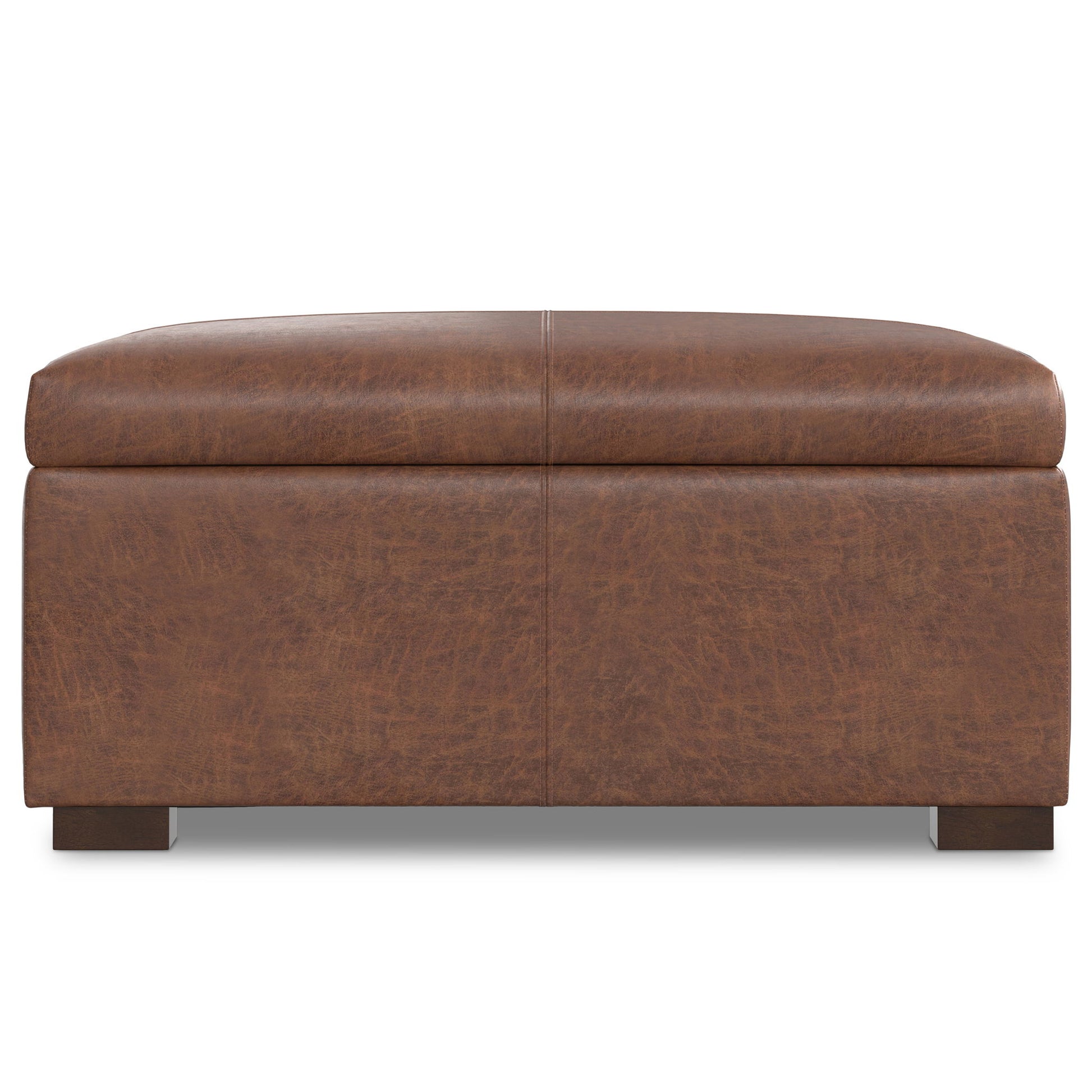 The Gabbie Coffee Table Upholstered Storage Ottoman features a rectangular brown leather design with a cushioned top and short wooden legs, displayed from the front against a white background.