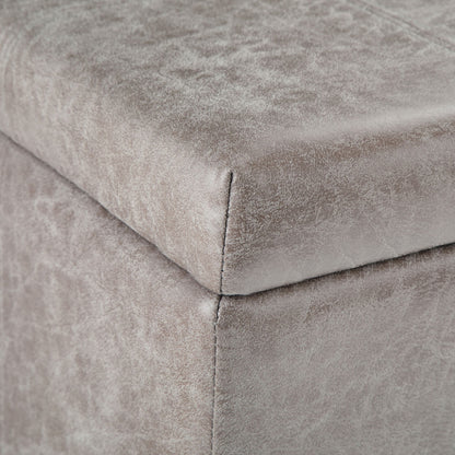 Close-up of the corner of the Dover Upholstered Storage Ottoman Bench, featuring soft gray velvet fabric and visible edge stitching.