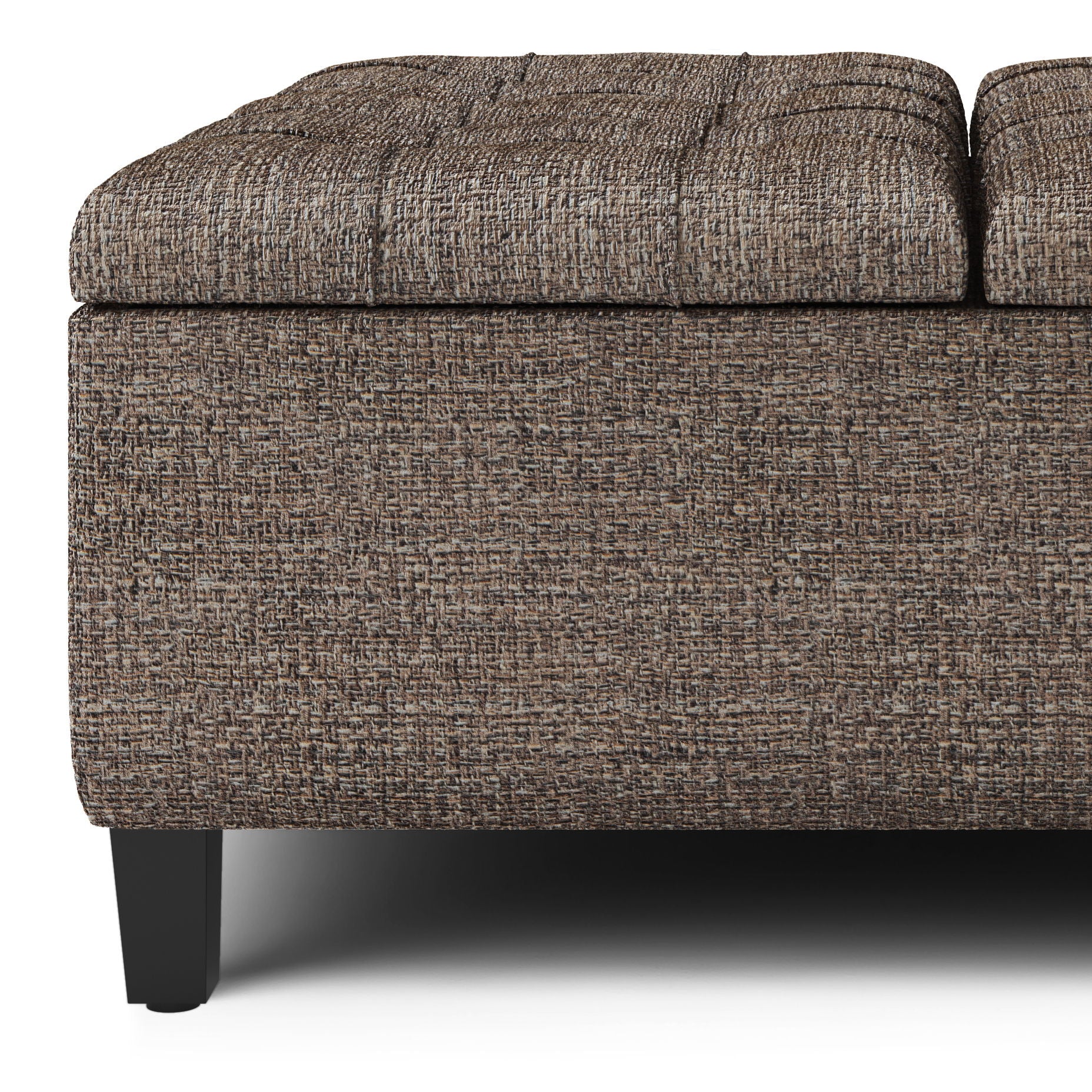 Close-up of the Harrison Upholstered Coffee Table Storage Ottoman, featuring textured brown fabric, a rectangular shape, black wooden legs, and a lid slightly raised to reveal storage space.
