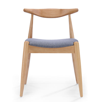 The Candescent Dining Chair (Set of 2) features a curved back, wood frame, angled legs, and a cushioned gray fabric seat, displayed against a plain white background.
