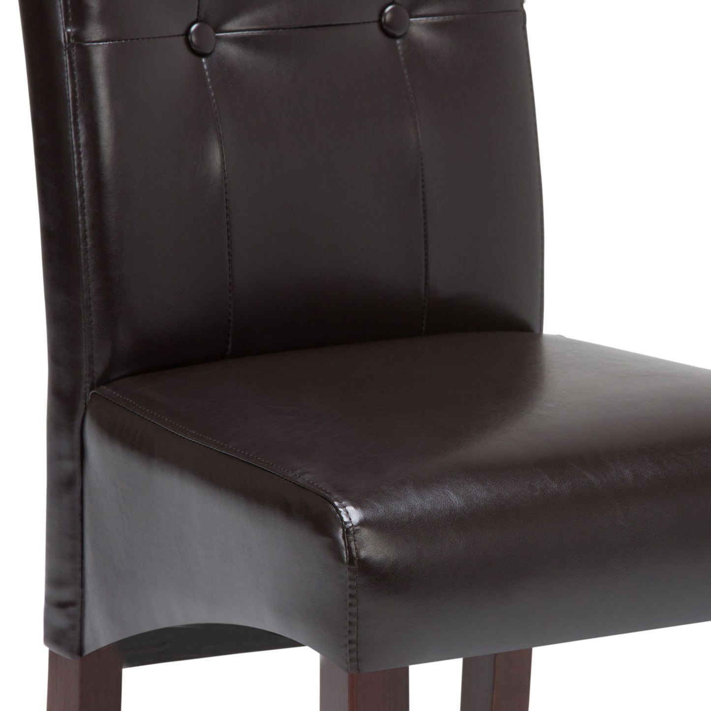 A close-up of the Cosmopolitan - Deluxe Tufted Parson Upholstered Chair (Set of 2) highlights its dark brown leather seat, button-accented backrest, and sturdy wooden legs.