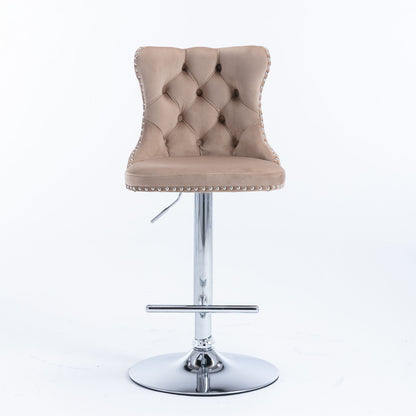 A set of 2 modern beige Swivel Velvet Barstools with tufted backs, cushioned seats, silver nailhead trim, chrome bases, footrests, and adjustable seat height from 25-33", shown against a plain white background.