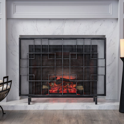 The Dorothy - Modern Single Panel Iron Fire Screen features a sleek black mesh with geometric designs, set against a white marble surround with gray veining. The warm fire creates a cozy, stylish atmosphere in the living space.