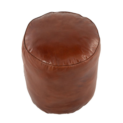 The Cobbler - Industrial High Quality Pouf in brown leather features visible stitching and a round design, shown from above on a white background.