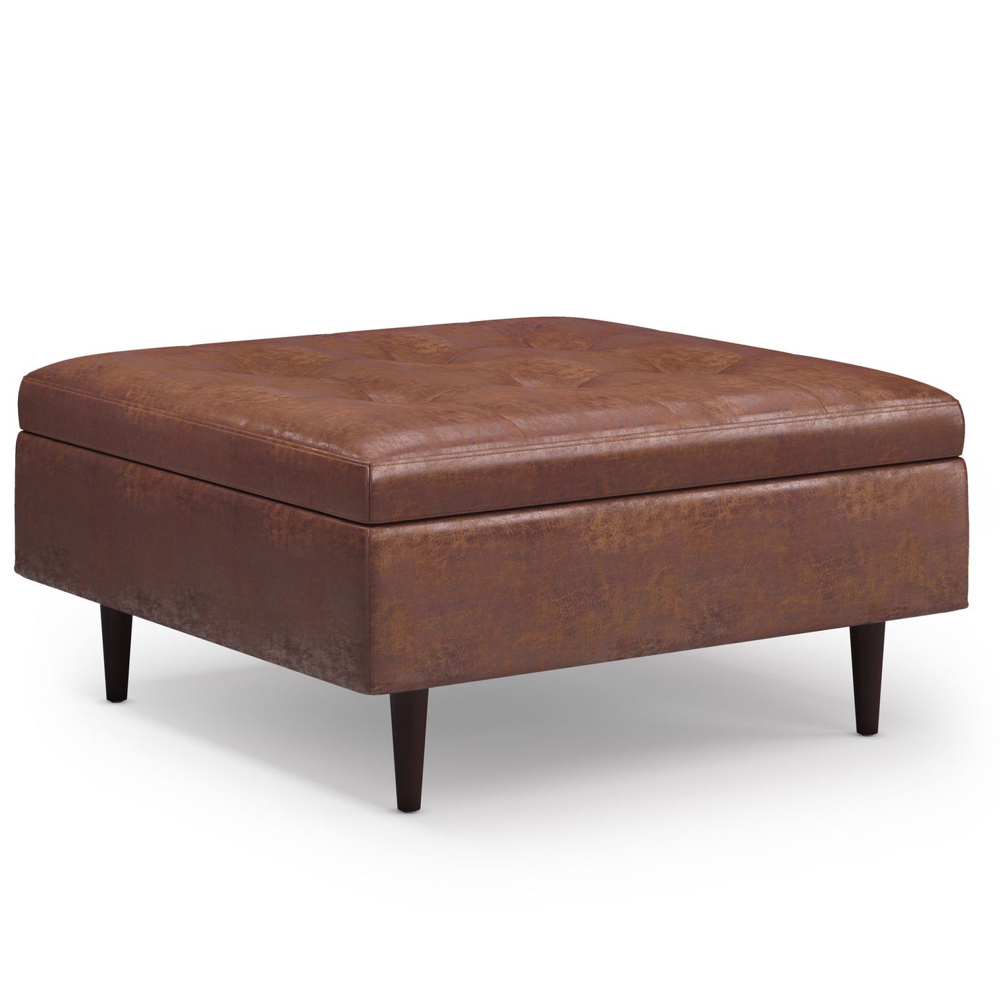 The Shay Large Square Coffee Table Storage Ottoman in brown leather features tufted detailing on top and dark wooden legs, shown on a white background.