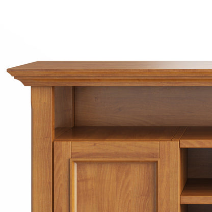 Close-up view of the upper section of the Amherst - TV Media Stand, Handcrafted, with a smooth finish, flat top, decorative trim, recessed shelf area, and warm medium-brown wood tone.