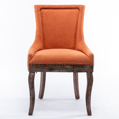Ultra Side Dining Chair set of 2, featuring thickened orange upholstery, high backrests, bronze nailhead trim, and neutrally toned solid wood curved legs, shown against a plain white background.